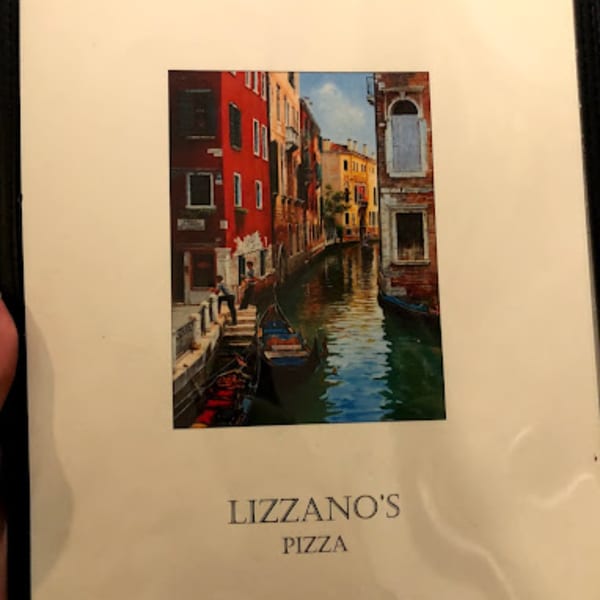 Lizzano's Pizza menu cover with a painting of a Venetian canal scene.